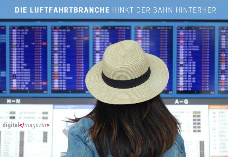Eine Frau mit Hut blickt auf den Bildschirm eines Flughafens, während die Digitalisierung in der Luftfahrtindustrie hinterherhinkt.